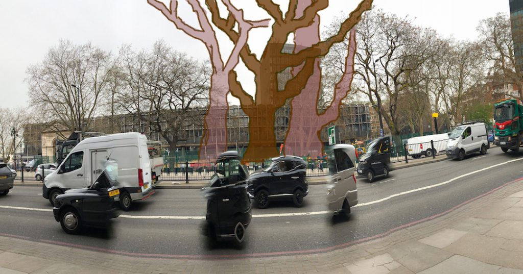 Looking across euston road towards the station , the ghosts of the murdered plane trees reach Xfar far up. In front, the vehicles have been ghosted