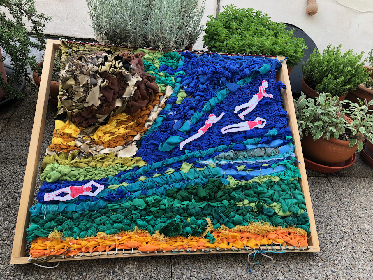 Here's my weave - with four swimmers in a slant blue river, with a chocolae brown mountain - its truly raised - with gold hints, top left, representing the Angolan highlands . Below the 'river' is gorgeous green and, ven lower, onion bag orange.