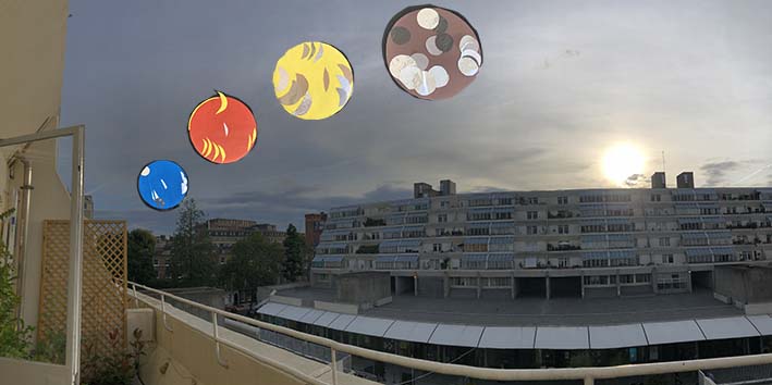 blue orange yellow and brown multi-moons outside my home. I only see one at a time - and they are not usuallty so brightly coloured - this is a draft for an an exhibition